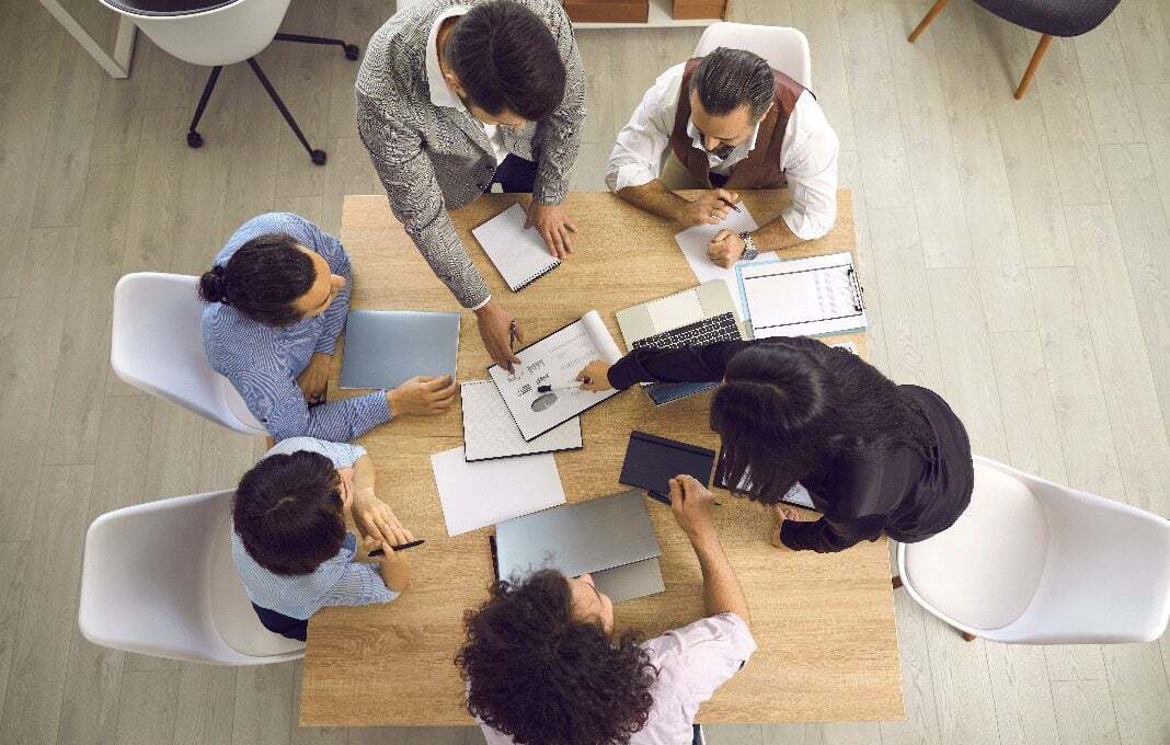 Project team collaborating around a table